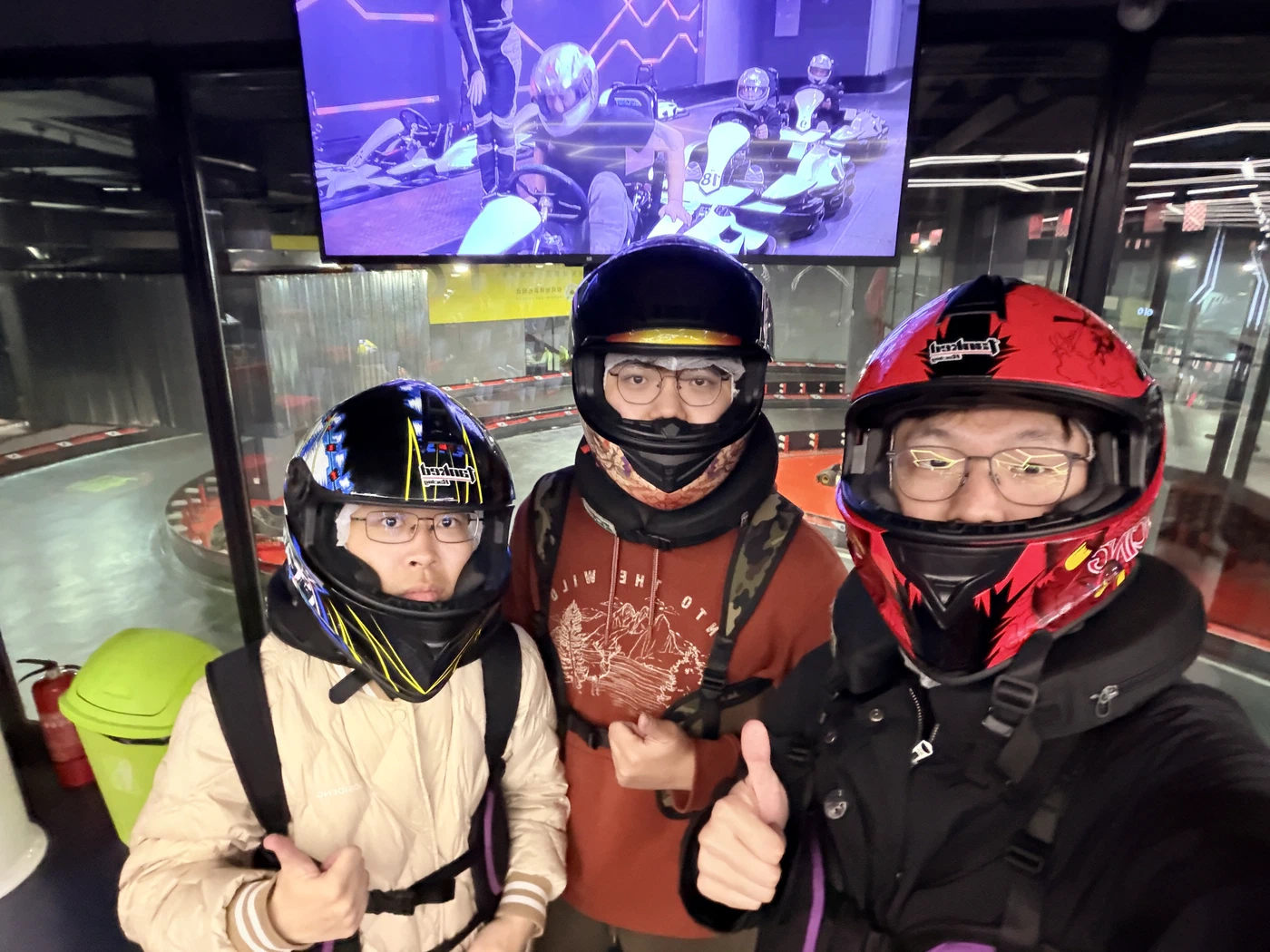 Kele, Keda, and Kejia at a karting track in Shanghai